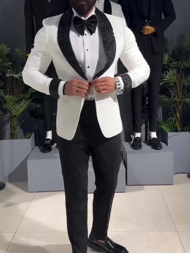 White tuxedo jacket with black sequin lapel.