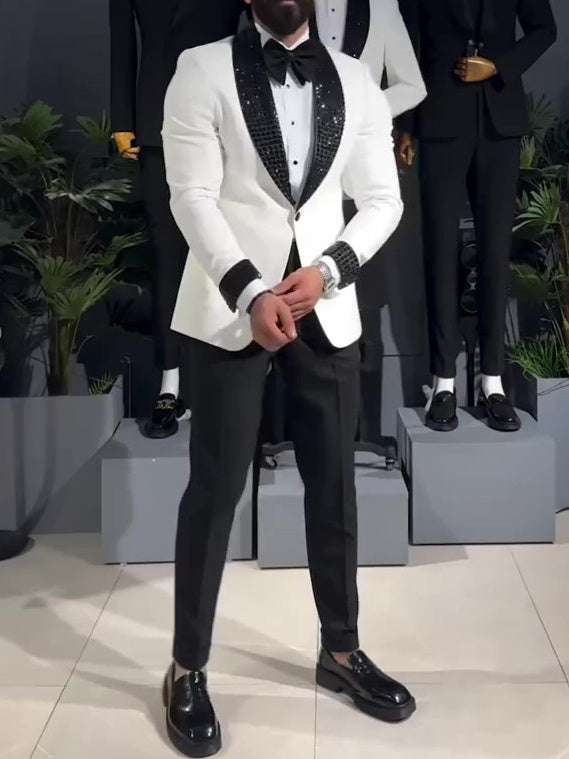 White tuxedo jacket with black sequin lapel.