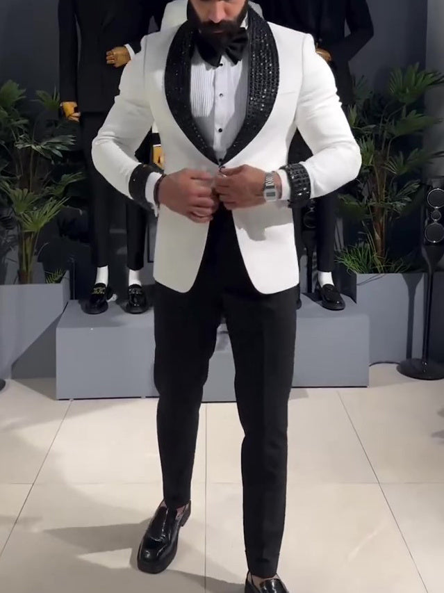 White tuxedo jacket with black sequin lapel.