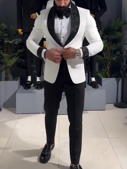 White tuxedo jacket with black sequin lapel.