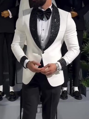 White tuxedo jacket with black sequin lapel.